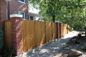wooden fence, board and batten solid privacy fence with clean capped top.