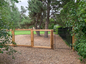 wood frame fence with metal gate
